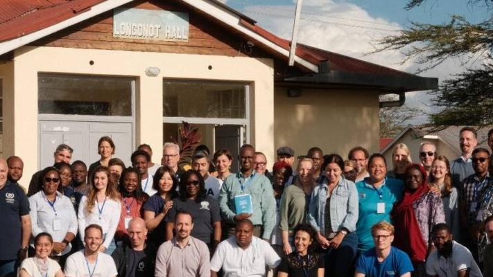 UNDAC Inducation participants in Nairobi take a group photo outside the learning center