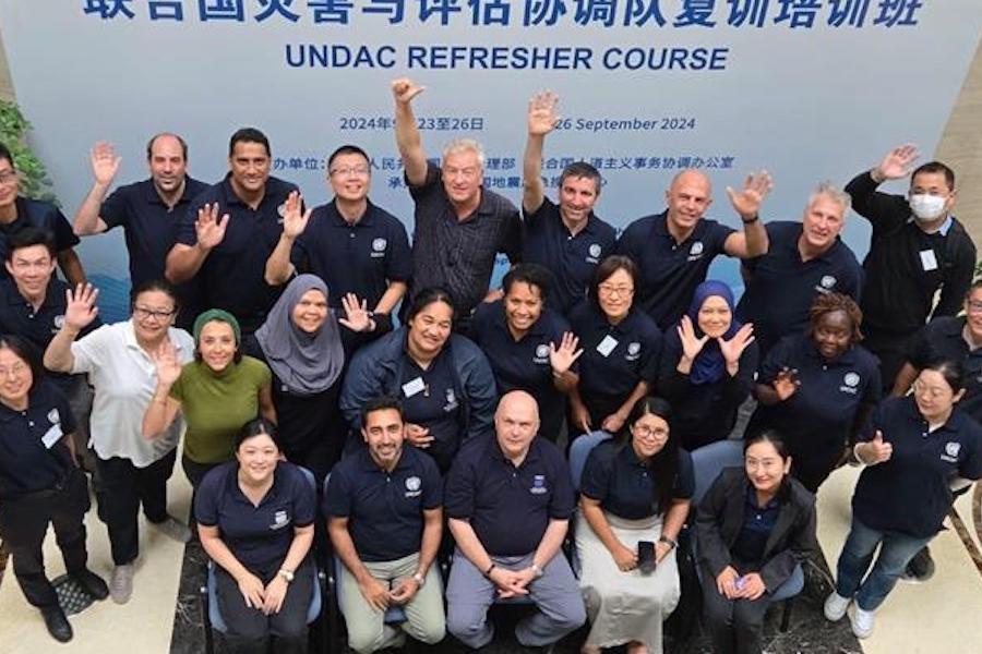 UNDAC China refresher participants looking up to the camera as a group