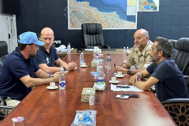 Meshari, with the blue hat, at UNDAC meeting with Derna Security chief, 2023.